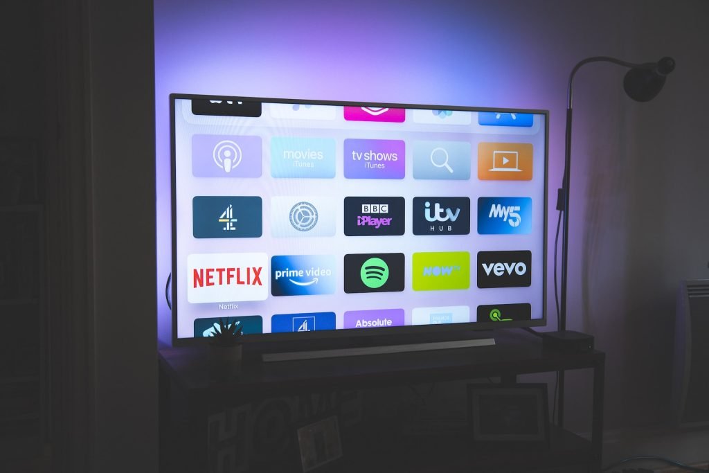 Bright TV with digital channels sitting on TV shelf