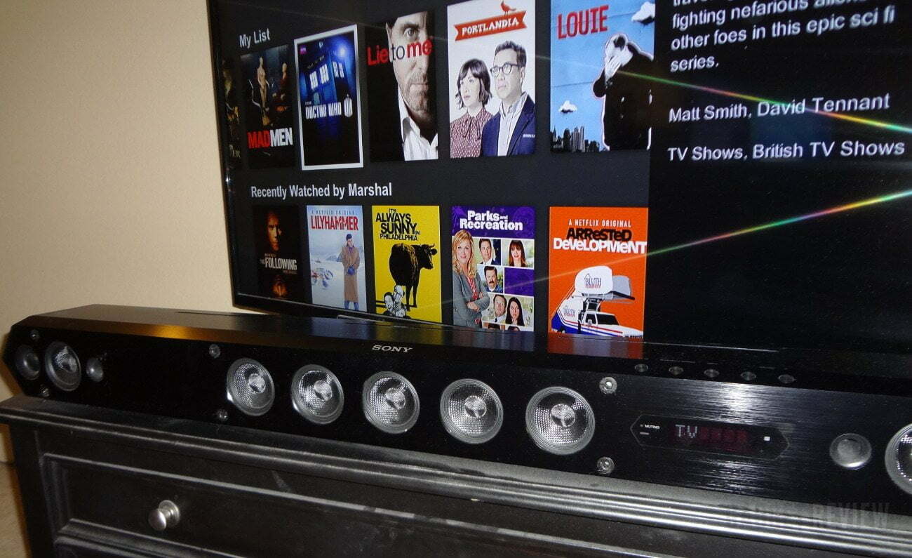 HTST7 HD Sound Bar in front of TV