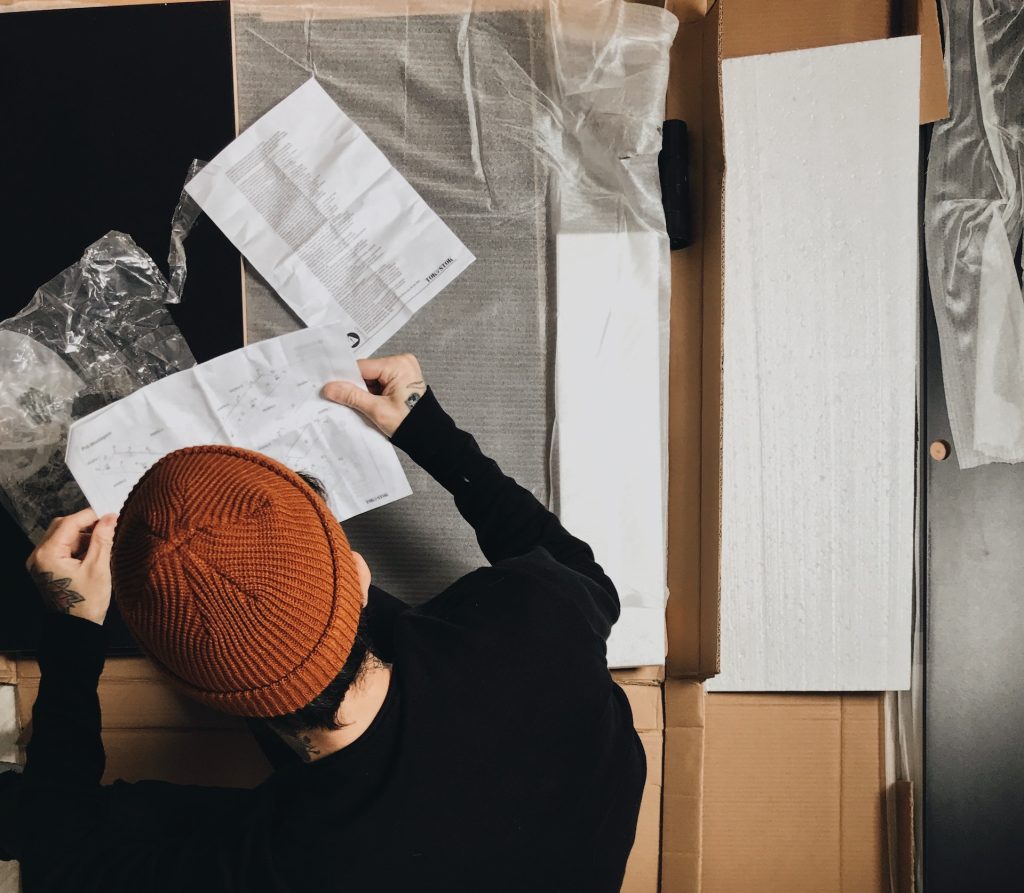 Man unsure if TV is 4K and reading user manual