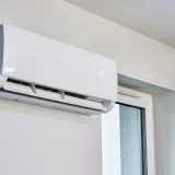 air conditioner running when heat is on