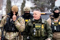 Border Patrol Bavino walks outside Speedway
