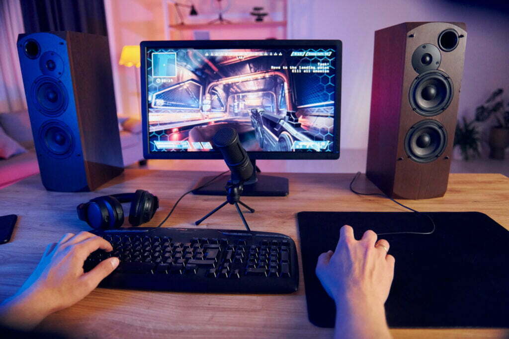a gaming mouse being used in a full setup