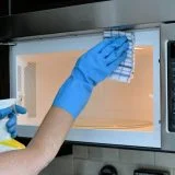 How to Clean Grease Off a Microwave Over a Stove