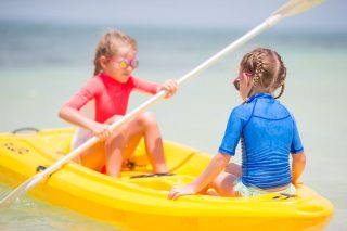 little adorable girls enjoying kayaking on yellow 2022 01 25 05 16 49 utc