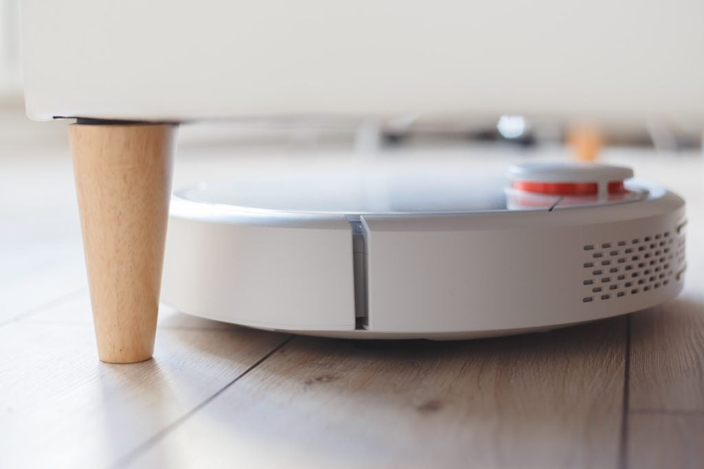 robot vacuum cleaner vacuuming under the bed 2022 12 16 21 52 25 utc